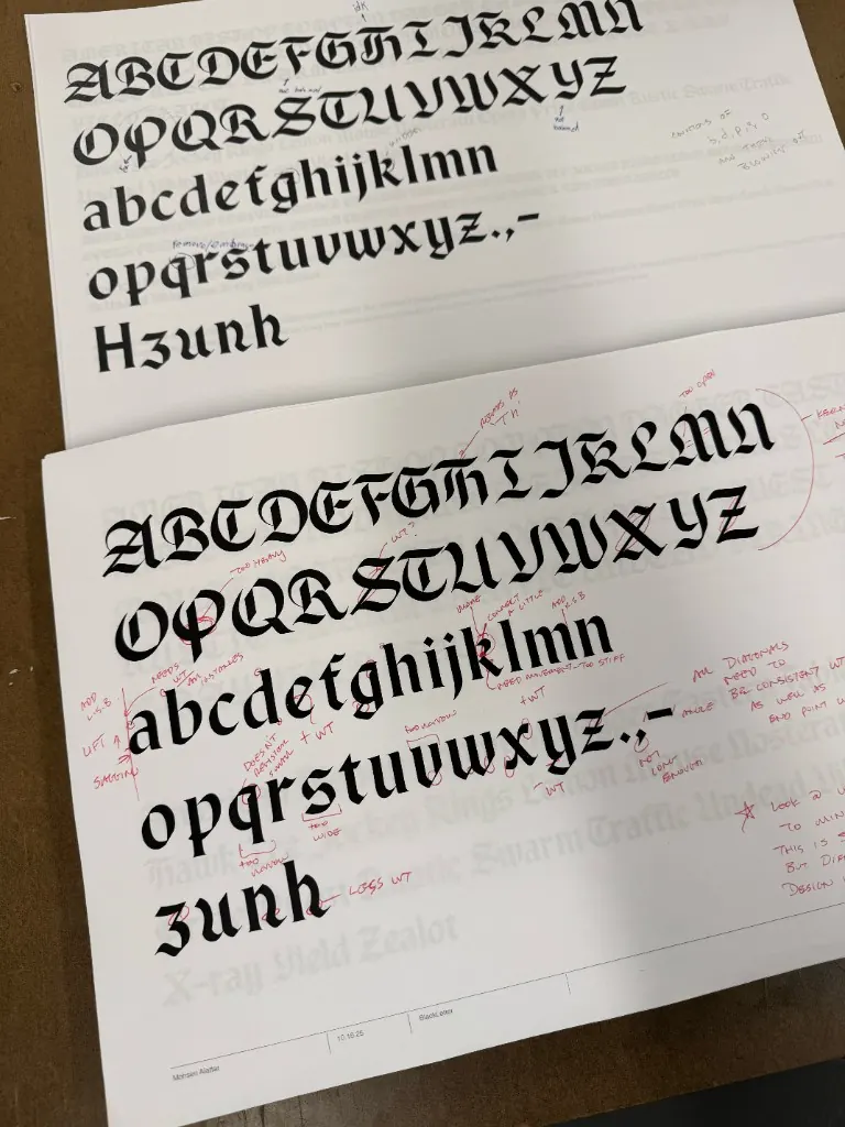 Early blackletter typeface development sheets with red markup
