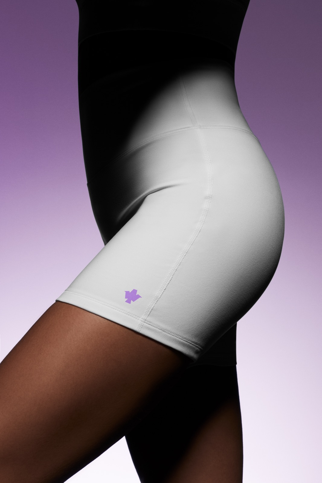Apparel — white shorts with purple mark