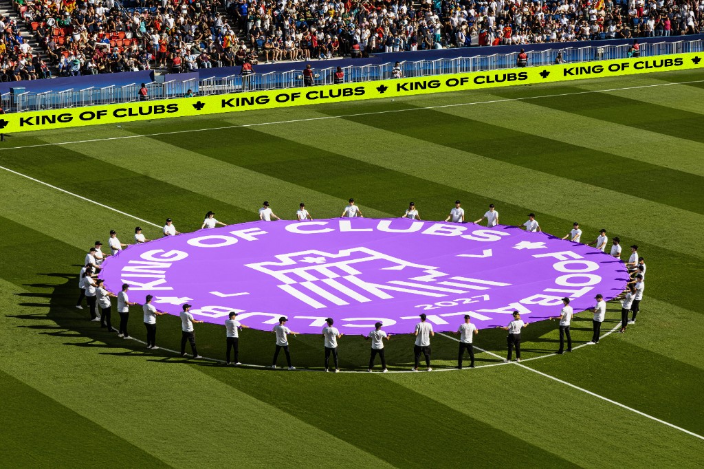 King of Clubs circular flag on a stadium pitch