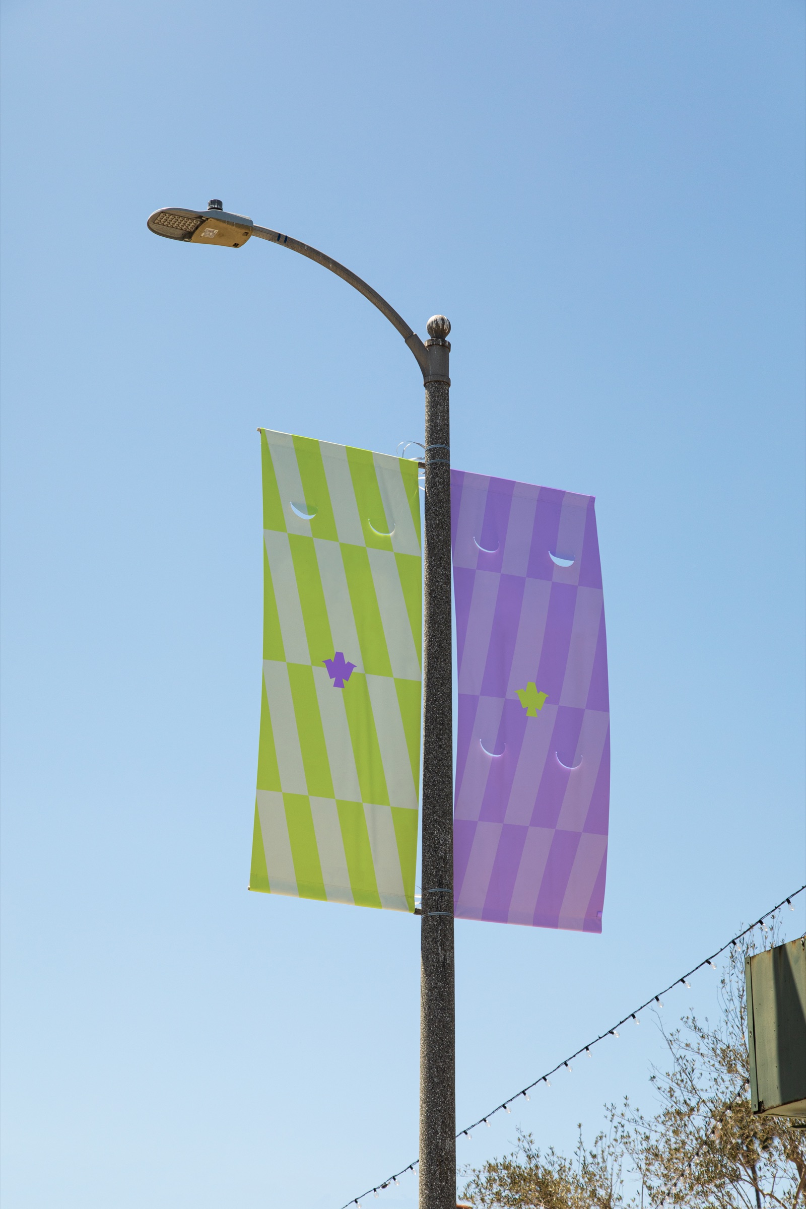 King of Clubs street light banners in volt and purple