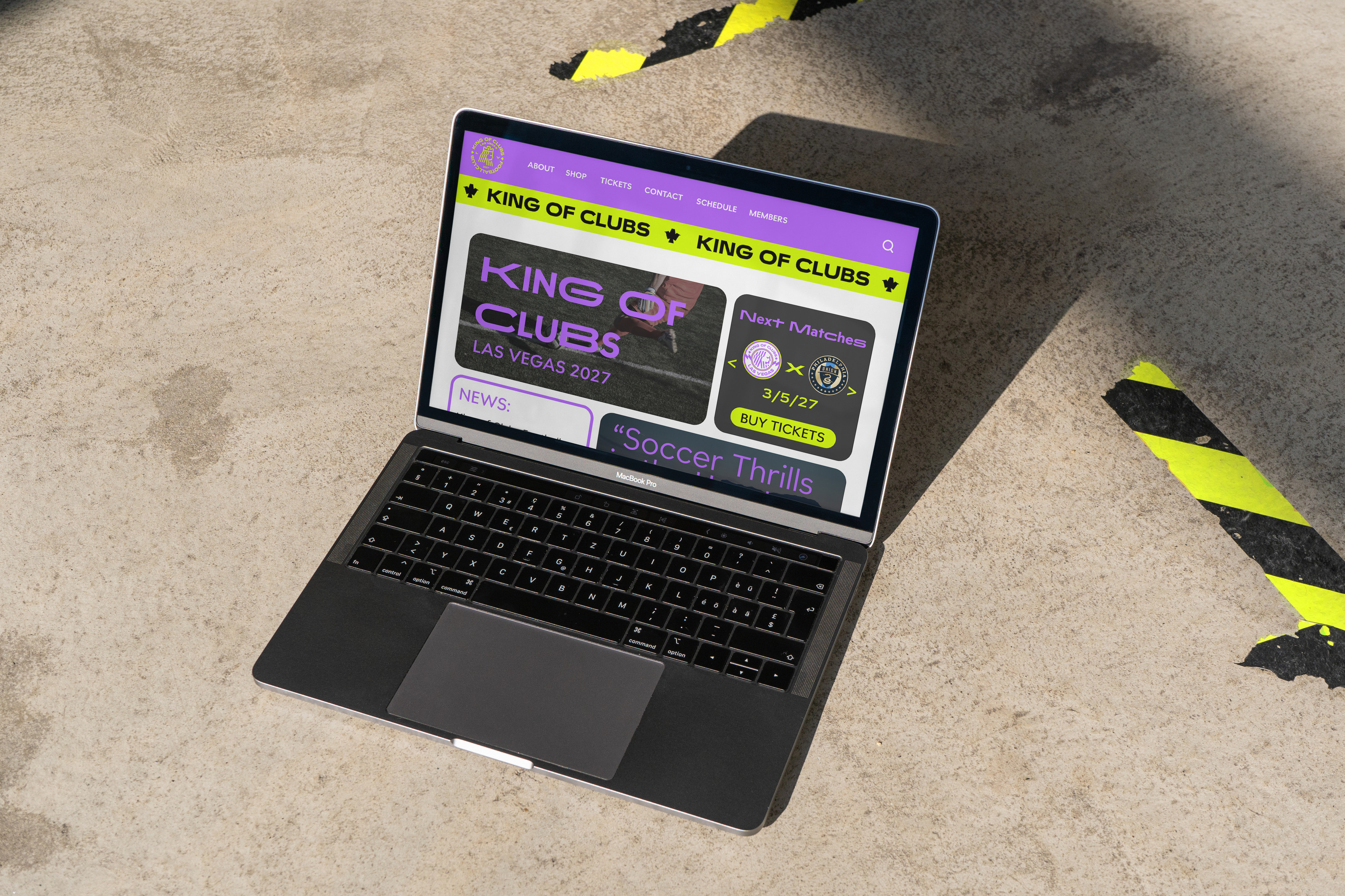 King of Clubs website mockup on a laptop